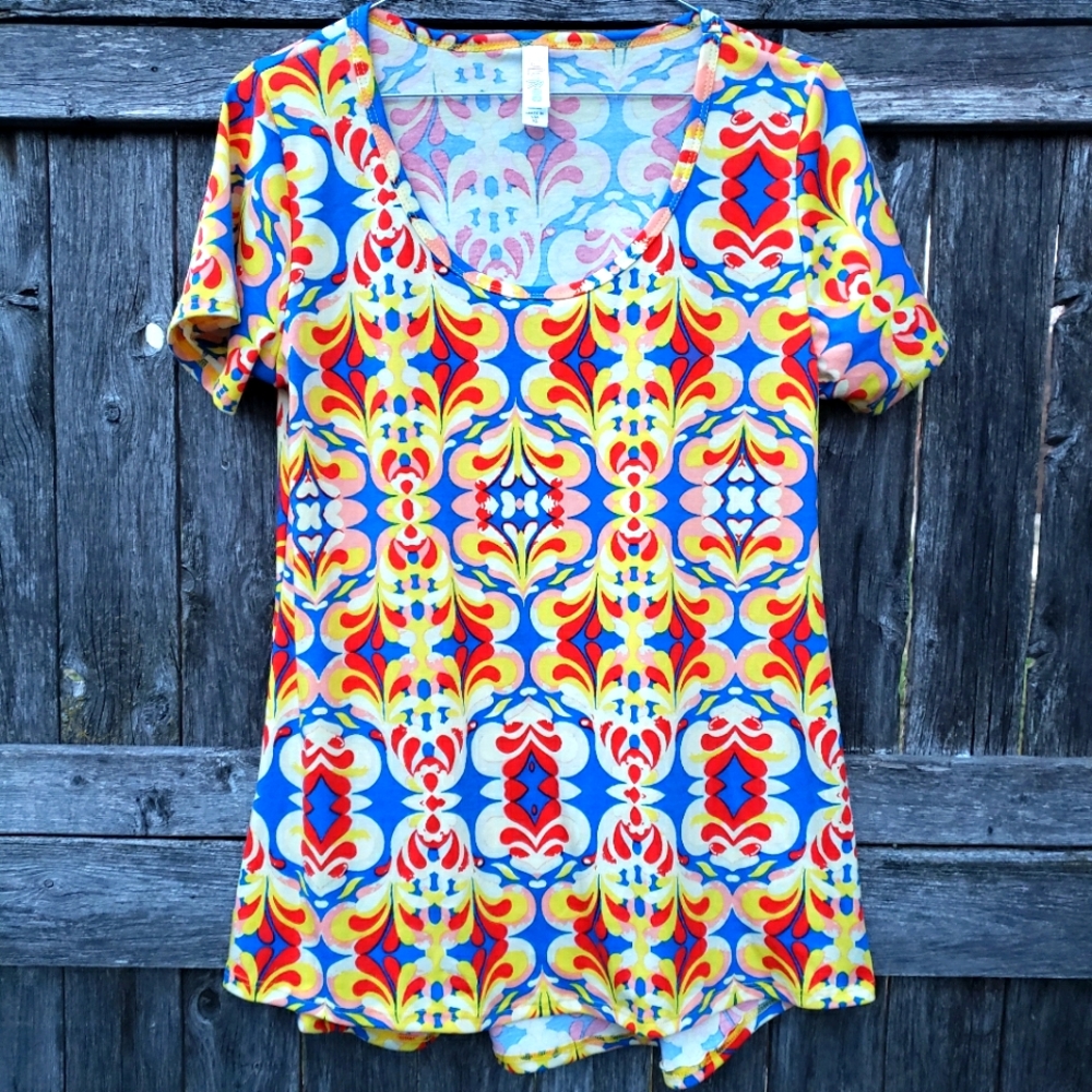 Brand new!! New LulaRoe vibrantly colorful soft & stretchy tunic top size small